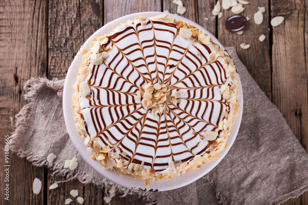 Traditional Hungarian Esterhazy cake .selective focus .Esterhazy cake with chocolate piece with a name of the cake: Traditional Hungarian Esterhazy cake .selective focus .Esterhazy cake with chocolate piece with a name of the cake: