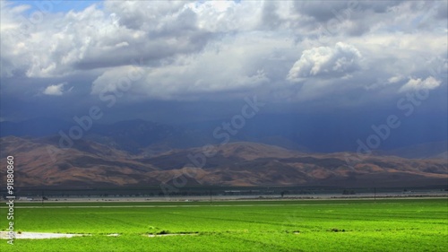 Time-lapse of rainclouds over mountains.