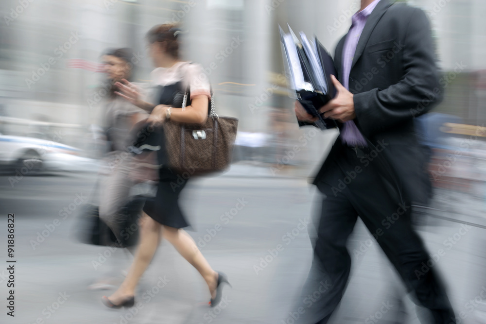 motion blurred business people walking on the street motion blurred business people walking on the street