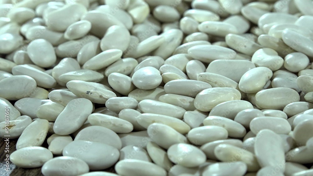 Portion of rotating White Beans (seamless loopable) as detailed 4K UHD footage Portion of rotating White Beans (seamless loopable) as detailed 4K UHD footage