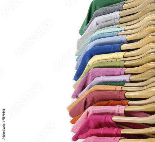 Top view Set of Choice of man clothes of different colors on wooden hangers  Stock Photo | Adobe Stock