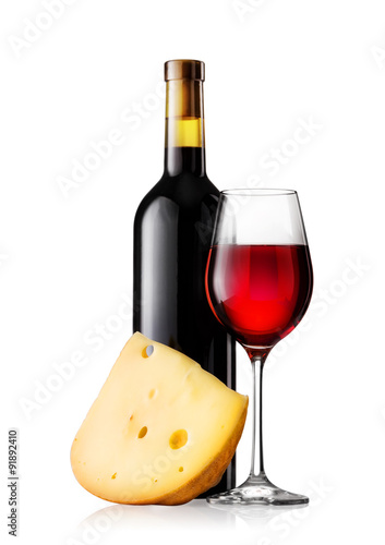 Glass and bottle of red wine with cheese