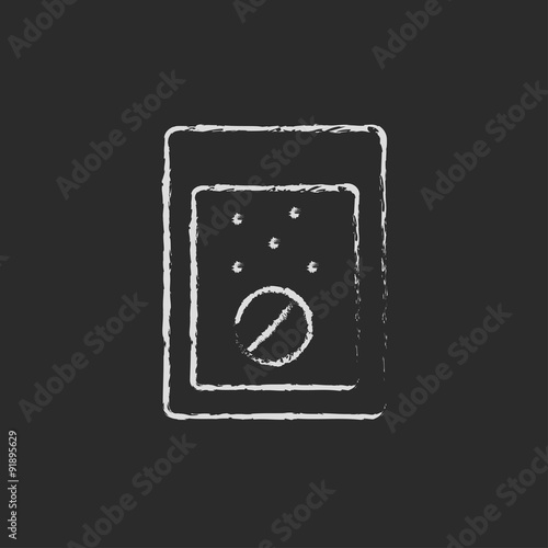 Tablet into a glass of water icon drawn in chalk.