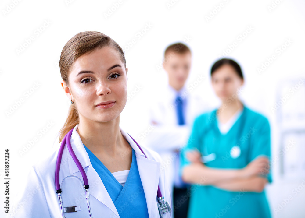 Woman doctor standing with stethoscope at hospital Woman doctor standing with stethoscope at hospital