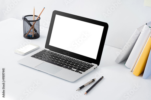 laptop, mobilephone and stationery on desk