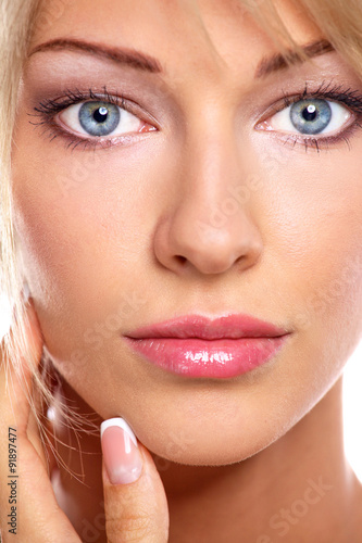 Close up portrait of beautiful young woman face. Isolated on