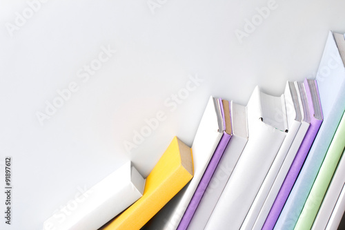 row of books on white background