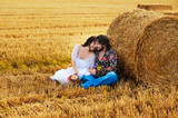 Couple sitting on the ground