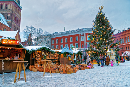 European Christmas market fair stalls with goods in Old Riga