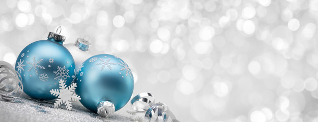 Blue Christmas balls with decoration on shiny background