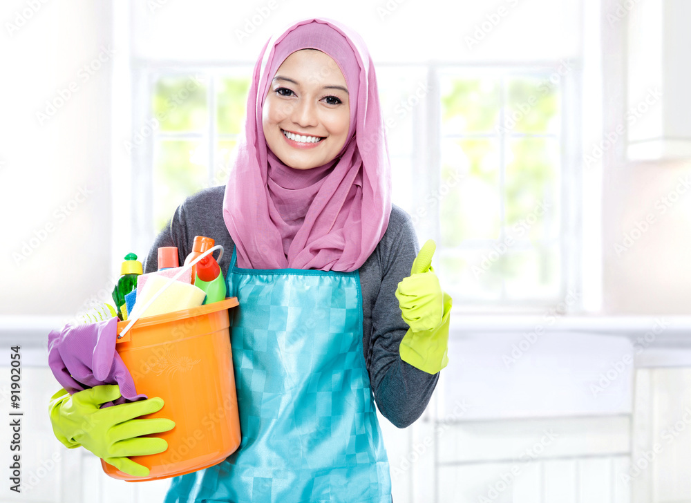 housewife wearing hijab holding bucket full of cleaning supplies housewife wearing hijab holding bucket full of cleaning supplies