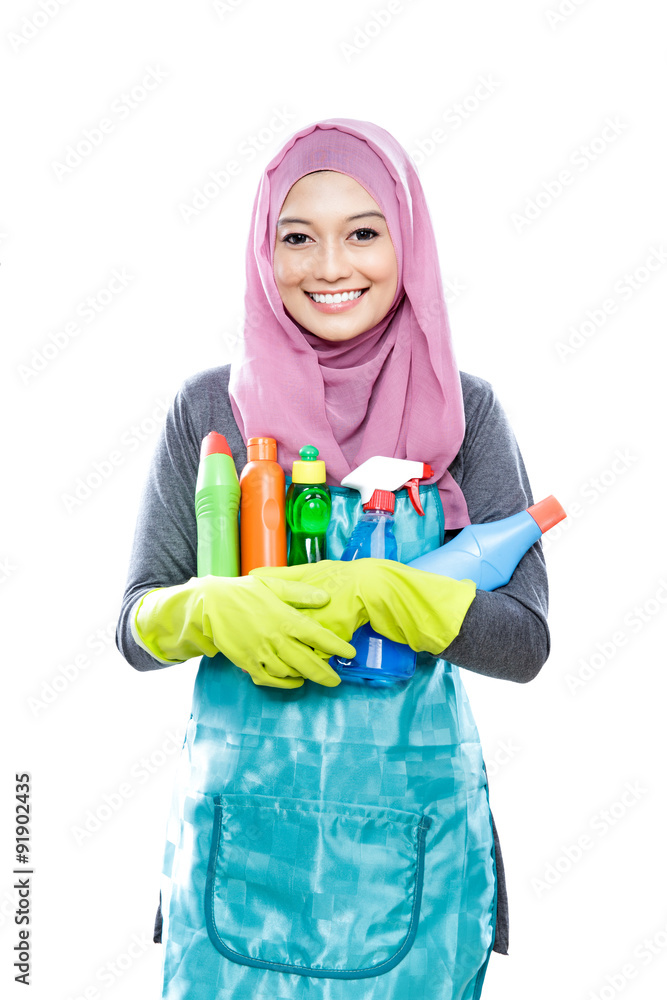 young housewife carrying many bottles of cleaning fluid young housewife carrying many bottles of cleaning fluid