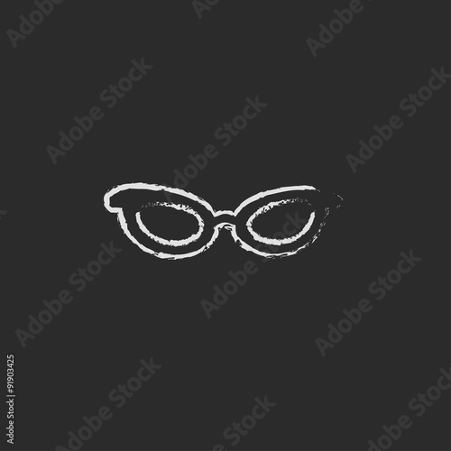 Eyeglasses icon drawn in chalk.