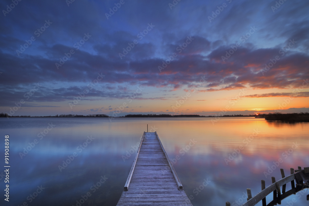 Naklejka premium Jetty on a lake at sunrise, near Amsterdam The Netherlands