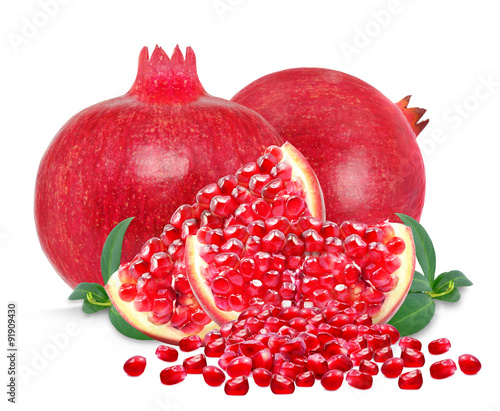 pomegranate and slices isolated on a white background
