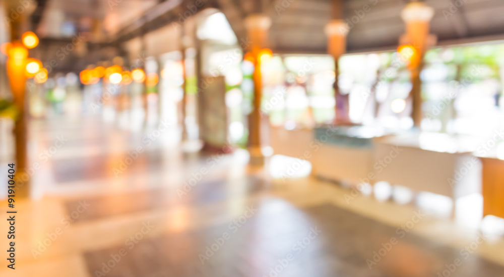 blurred background. street decorated with festive lights.