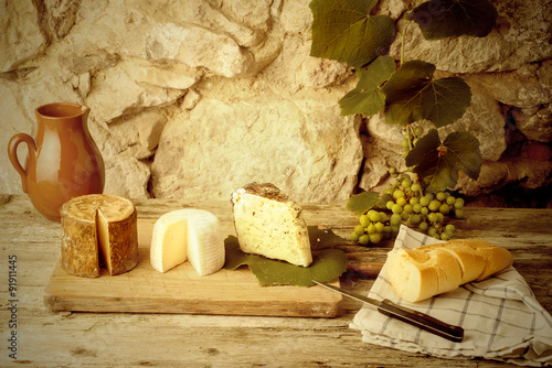  Rustic still life, cheese varieties photo
