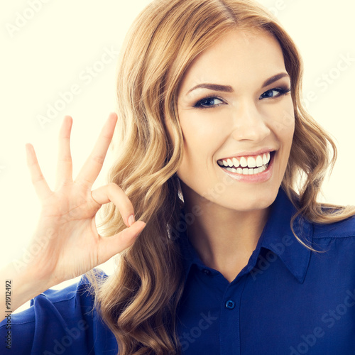 Businesswoman with okay gesture