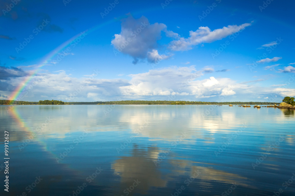 September rainbow over Swedish lake