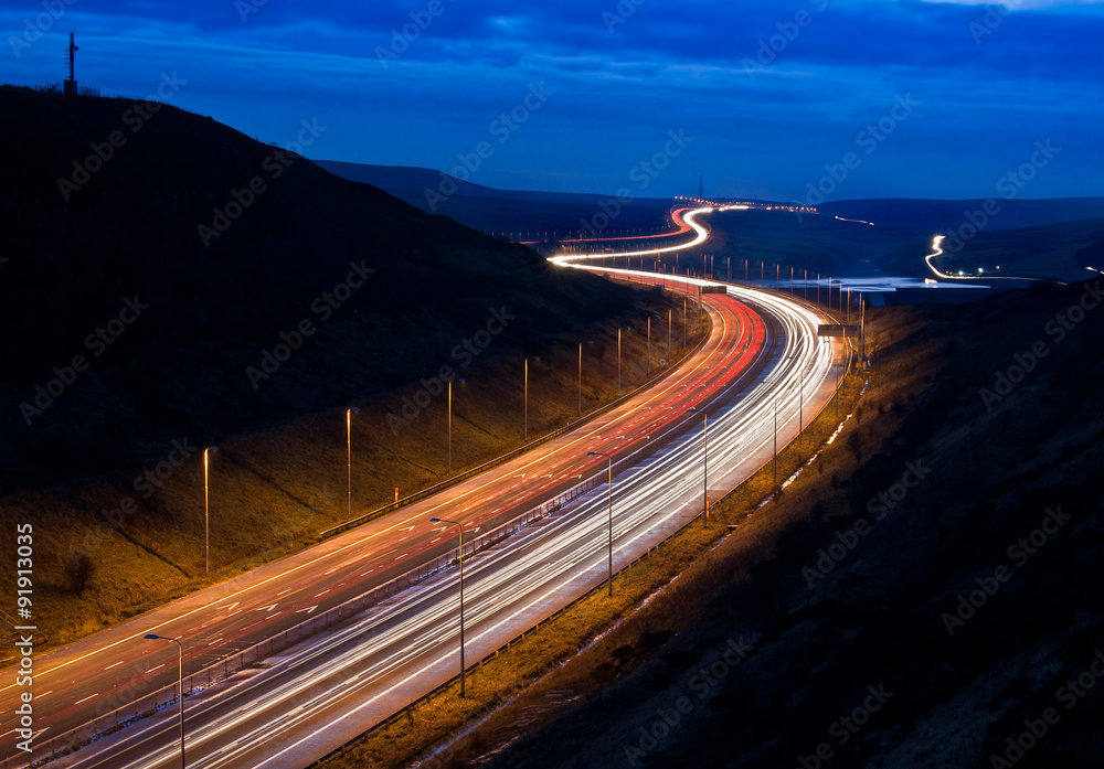 Light trails on the M62 motorway near Scammonden, Yorkshire, UK