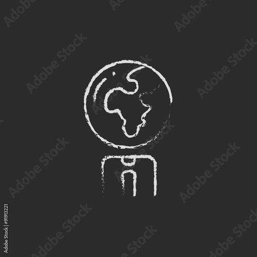 Human with globe head icon drawn in chalk.