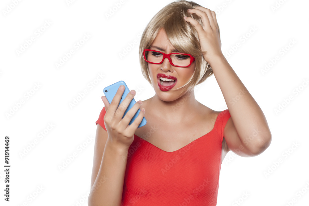 unhappy beautiful blonde with short hair reading a text message unhappy beautiful blonde with short hair reading a text message