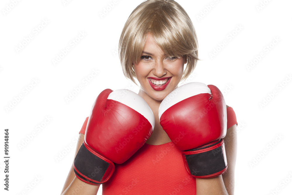 beautiful blonde with short hair posing with boxing gloves beautiful blonde with short hair posing with boxing gloves