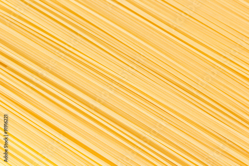 Uncooked spaghetti lie on a diagonal direction