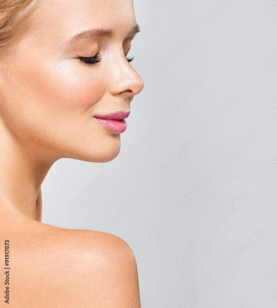 Beautiful face of young adult woman with clean fresh skin. Beautiful face of young adult woman with clean fresh skin.