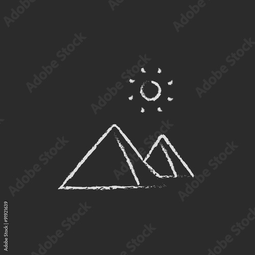 Egyptian pyramids icon drawn in chalk.