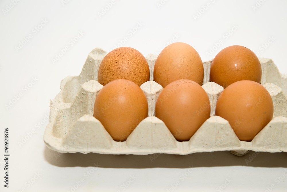 Chicken eggs in the package for sale on over white Chicken eggs in the package for sale on over white