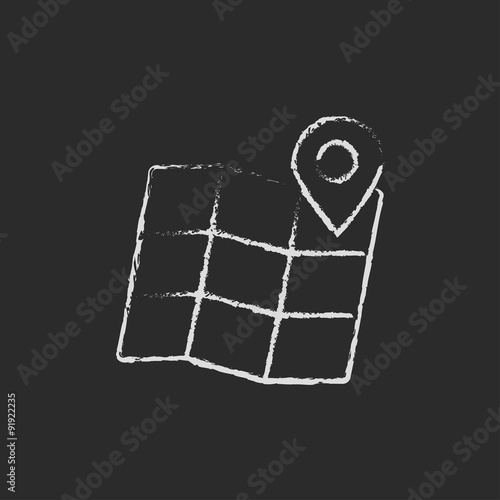 Map with pointer icon drawn in chalk.