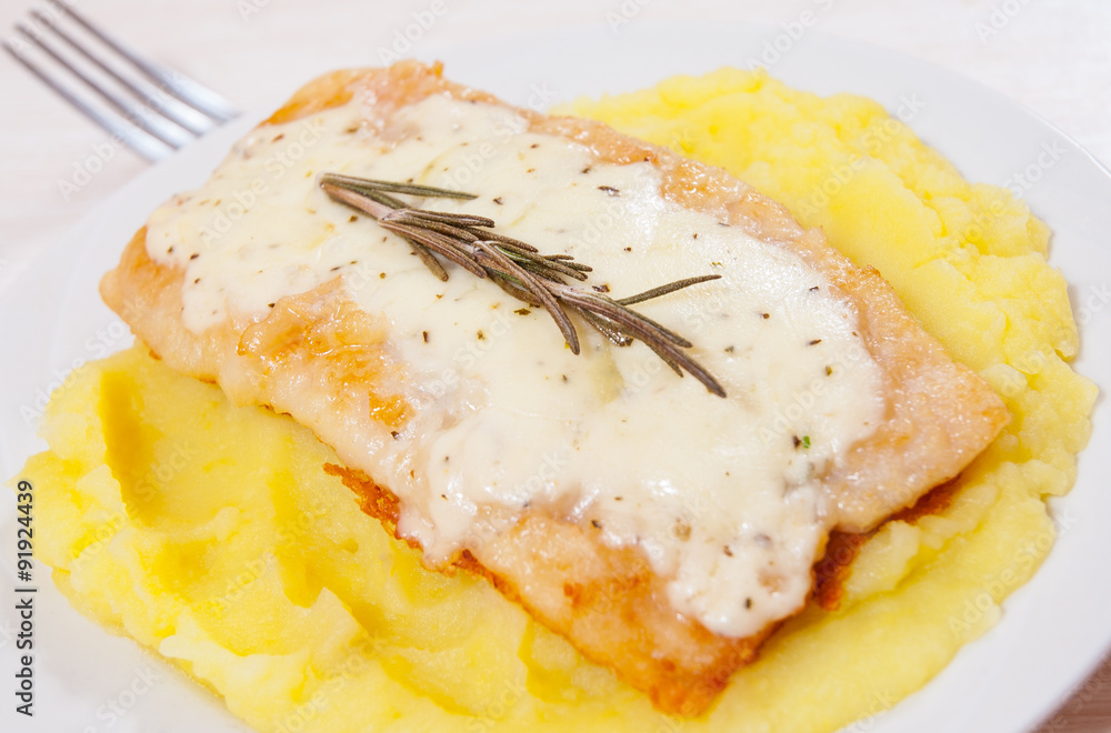 fish fillet under cheese with mashed potatoes fish fillet under cheese with mashed potatoes