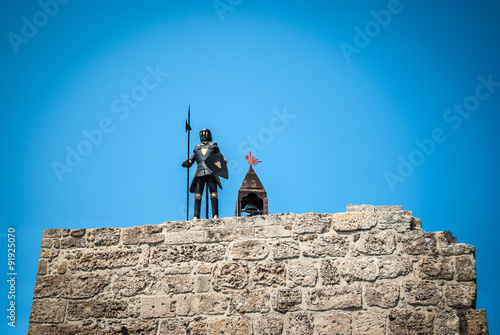 Knight with armour on a wall in the Old Rhodes Town in Greece