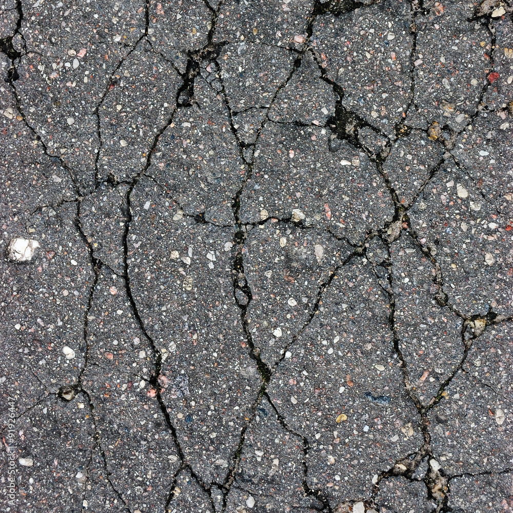 Obraz premium Old aged weathered cracked tarmac texture large detailed damaged asphalt macro closeup