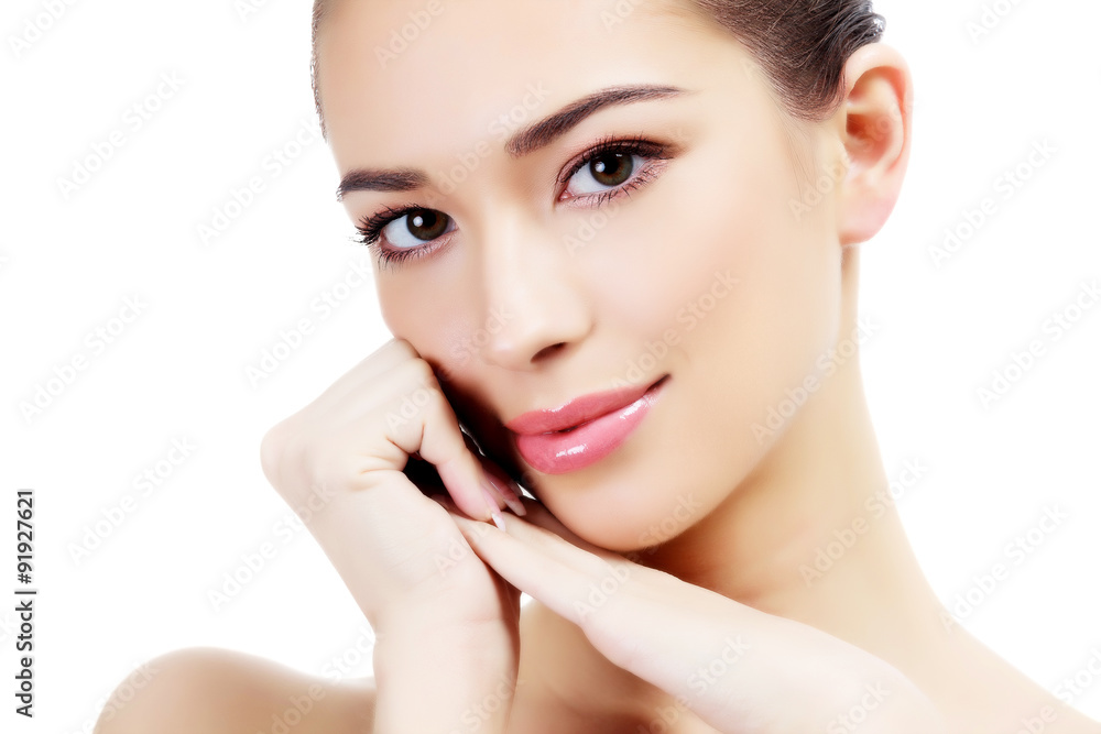 Young female with clean fresh skin, white background. Young female with clean fresh skin, white background.