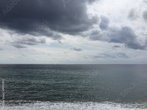 Grey sky reflects in the grey sea