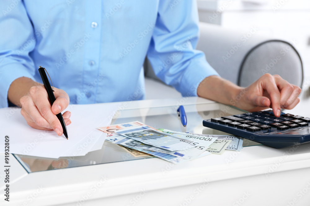 Fototapeta premium Accounting concept.Analyzing finance report with calculator