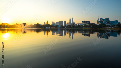 KUALA LUMPUR, MALAYSIA - FEBRUARY 20, 2015:  Sunrise view of Kuala Lumpur at Lake Titiwangsa, Malaysia.The lake  is located just beside the busy Jalan Tun Razak in the heart of Kuala Lumpur, Malaysia.