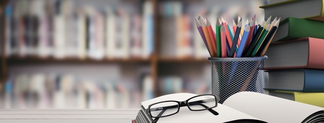 Composite image of school supplies on desk