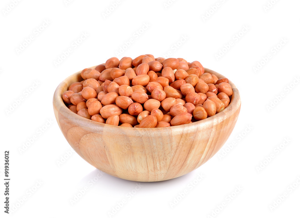 wooden bowl of groundnuts (peanut) on white background wooden bowl of groundnuts (peanut) on white background