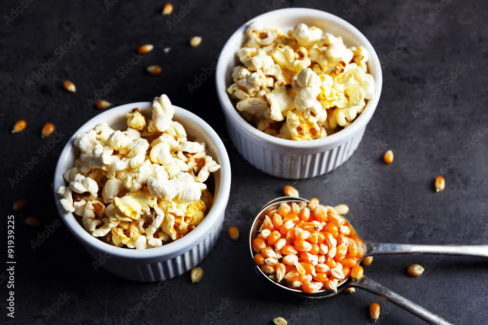 Popcorn in bowls on dark background Popcorn in bowls on dark background