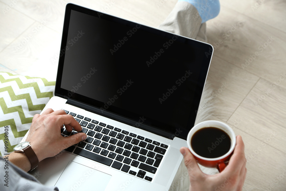 Man working with laptop at home Man working with laptop at home