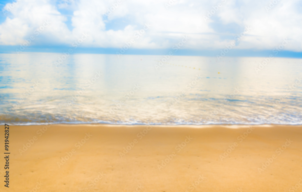 blur image of sea shore and clear blue sky  for background usage