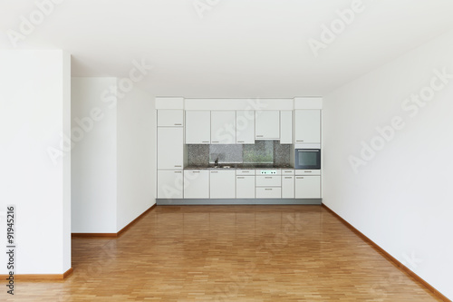 empty living room with kitchen