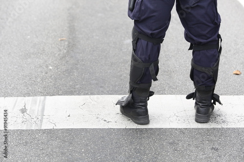 Police Officer in Tactical Boots with Protectors