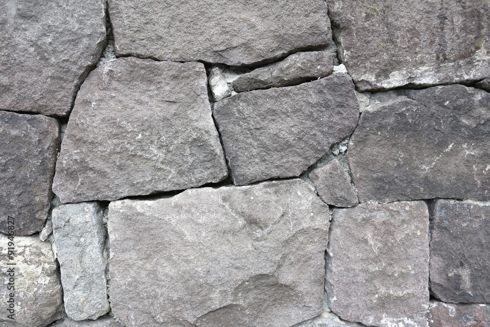 Obraz premium Stacked old stone wall.