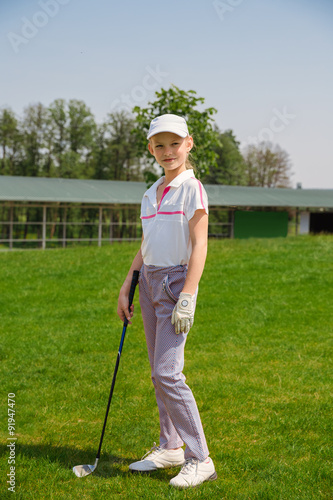 Girl playing golf