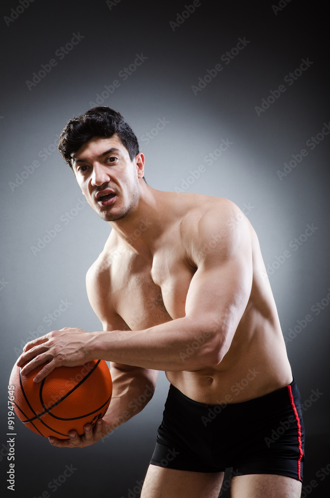Muscular basketball in sports concept Muscular basketball in sports concept