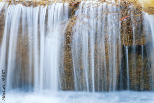 flowing waterfall by long exposure taking photography